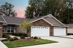 Altoona apartment for rent - A house with a white garage door and a driveway.