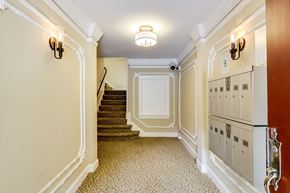 San Francisco apartment for rent - A hallway with a staircase and a red door.