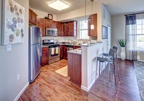 Rocky Hill apartment for rent - a kitchen with stainless steel appliances and wooden cabinets