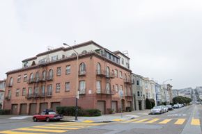 San Francisco apartment for rent - A red car is parked on the side of the street.