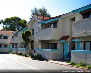 Paramount apartment for rent - an apartment building with blue and white walls and stairs