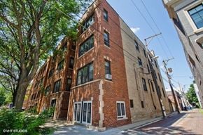 Chicago apartment for rent - a tall brick building on a city street