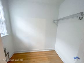 Evanston apartment for rent - an empty room with white walls and a wooden floor and a window