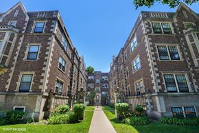 Evanston apartment for rent - a row of brick apartment buildings on a sidewalk