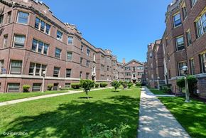 Evanston apartment for rent - a large green lawn in front of a brick building