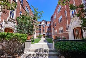 Evanston apartment for rent - a pathway between two brick buildings on a sunny day