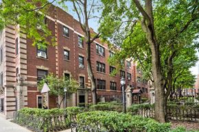 Chicago apartment for rent - a large brick building with trees in front of it