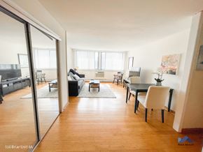 Chicago apartment for rent - a view of the living room and dining room from the hallway
