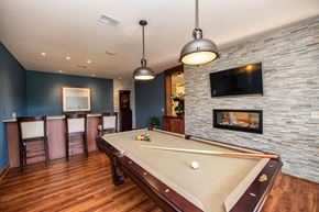 Middleton apartment for rent - a game room with a pool table and a fireplace