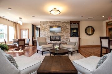 Middleton apartment for rent - a living room with couches and chairs and a fireplace