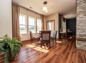 Middleton apartment for rent - a dining room with a table and chairs on a wood floor