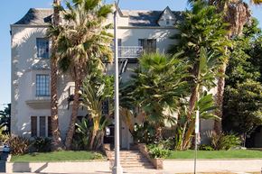 Los Angeles apartment for rent - a white house with palm trees in front of it