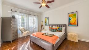 Los Angeles apartment for rent - a bedroom with a bed and a ceiling fan