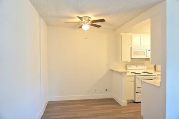 Northridge apartment for rent - A small kitchen with a wood floor and a ceiling fan.