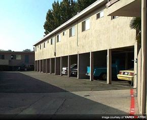 La Habra apartment for rent - a parking garage with cars parked in it