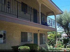 Whittier apartment for rent - a building with a balcony with chairs and a patio