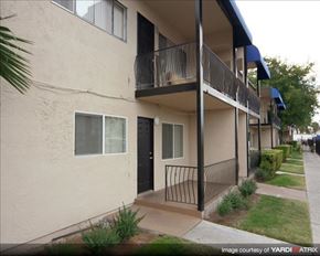 Las Vegas apartment for rent - an apartment building with a balcony and a black door