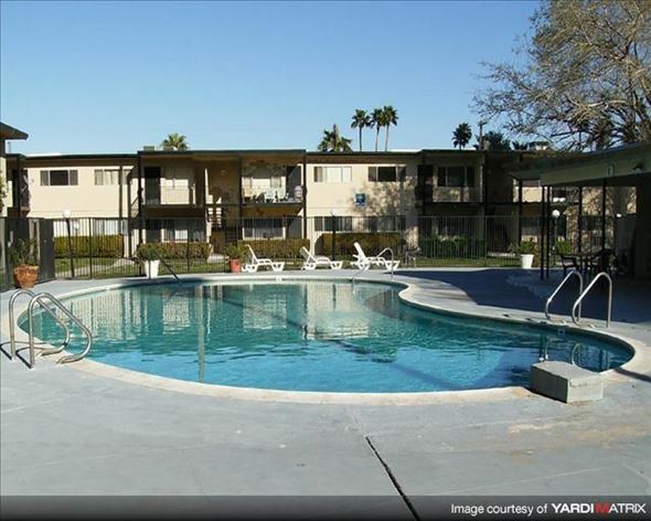 Las Vegas apartment for rent - a swimming pool in front of an apartment building