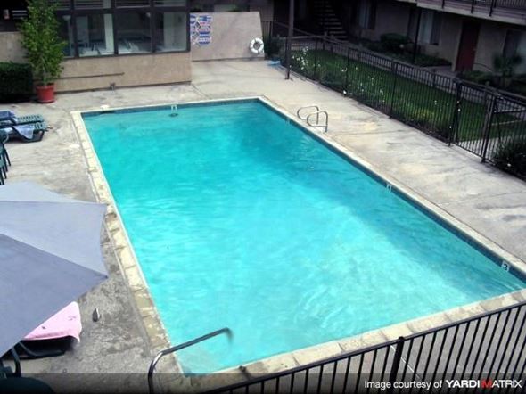 La Puente apartment for rent - a large swimming pool in front of a building