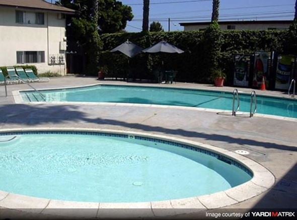 Bellflower apartment for rent - a swimming pool with an umbrella next to it