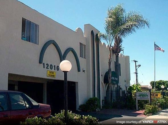 Norwalk apartment for rent - a building with a mcdonalds sign and a car parked in front