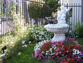 Anaheim apartment for rent - a fountain in the middle of a garden of flowers