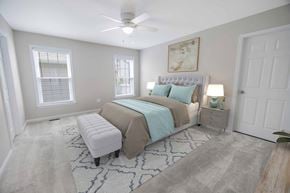 Newark apartment for rent - a bedroom with a bed and a ceiling fan