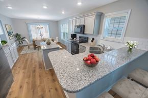 Newark apartment for rent - an open kitchen and living room with a granite counter top