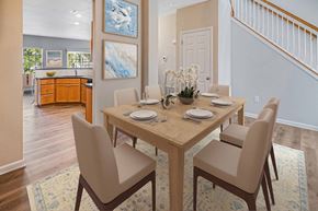 Wilmington triplex for rent - a dining room with a wooden table and chairs