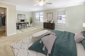 Wilmington triplex for rent - a bedroom with a bed and a desk