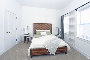 Newton apartment for rent - Bedroom model with carpeted floors and white walls, double windows and walk-in closet