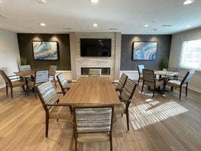 New Berlin apartment for rent - a conference room with a large table and chairs and a television