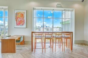 Charlotte apartment for rent - a dining room with a table and chairs in front of a window