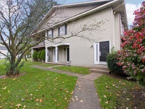 Temperance townhouse for rent - a white house with a sidewalk in front of it