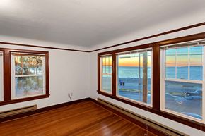 Seattle apartment for rent - a living room with a view of the beach and the ocean