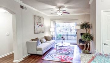 Austin apartment for rent - a living room with a couch and a ceiling fan
