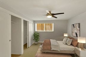 Denver apartment for rent - a bedroom with a bed and a ceiling fan