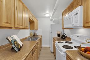 Denver apartment for rent - a kitchen with a stove microwave and sink