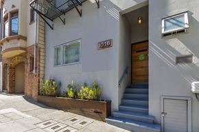 San Francisco apartment for rent - A house numbered 1016 with a brown door and a small window.