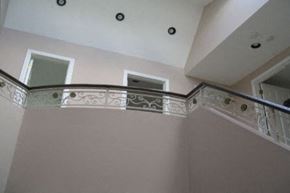 Toronto apartment for rent - A staircase with a metal railing and a balustrade.