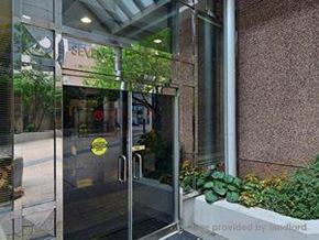 Toronto apartment for rent - A glass door with a yellow sticker on it.