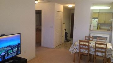 Toronto apartment for rent - A living room with a television and a dining area.
