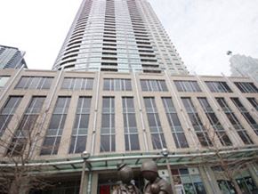Toronto apartment for rent - A tall building with a statue in front of it.
