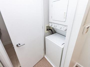 Toronto apartment for rent - A white oven is built into a wall in a kitchen.