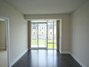 Toronto apartment for rent - A room with a sliding glass door leading to a balcony.