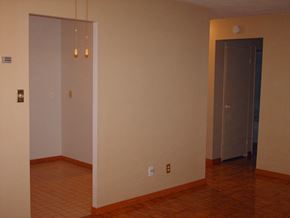 Toronto apartment for rent - A room with a white door and a brown door.