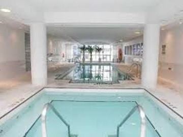 Toronto apartment for rent - A large indoor swimming pool with a glass bottom.