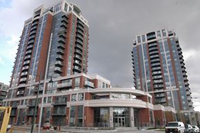 Toronto apartment for rent - Two modern high-rise buildings with balconies and glass windows.