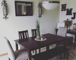 Jackson townhouse for rent - a dining room with a wooden table and chairs