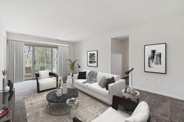 Gaithersburg apartment for rent - the living room of an apartment with white couches and chairs